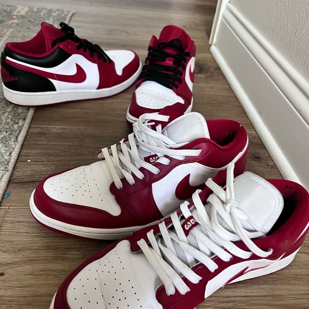 Two Jordan air 1 lows. Slightly worn. Both shoes have slight creases.